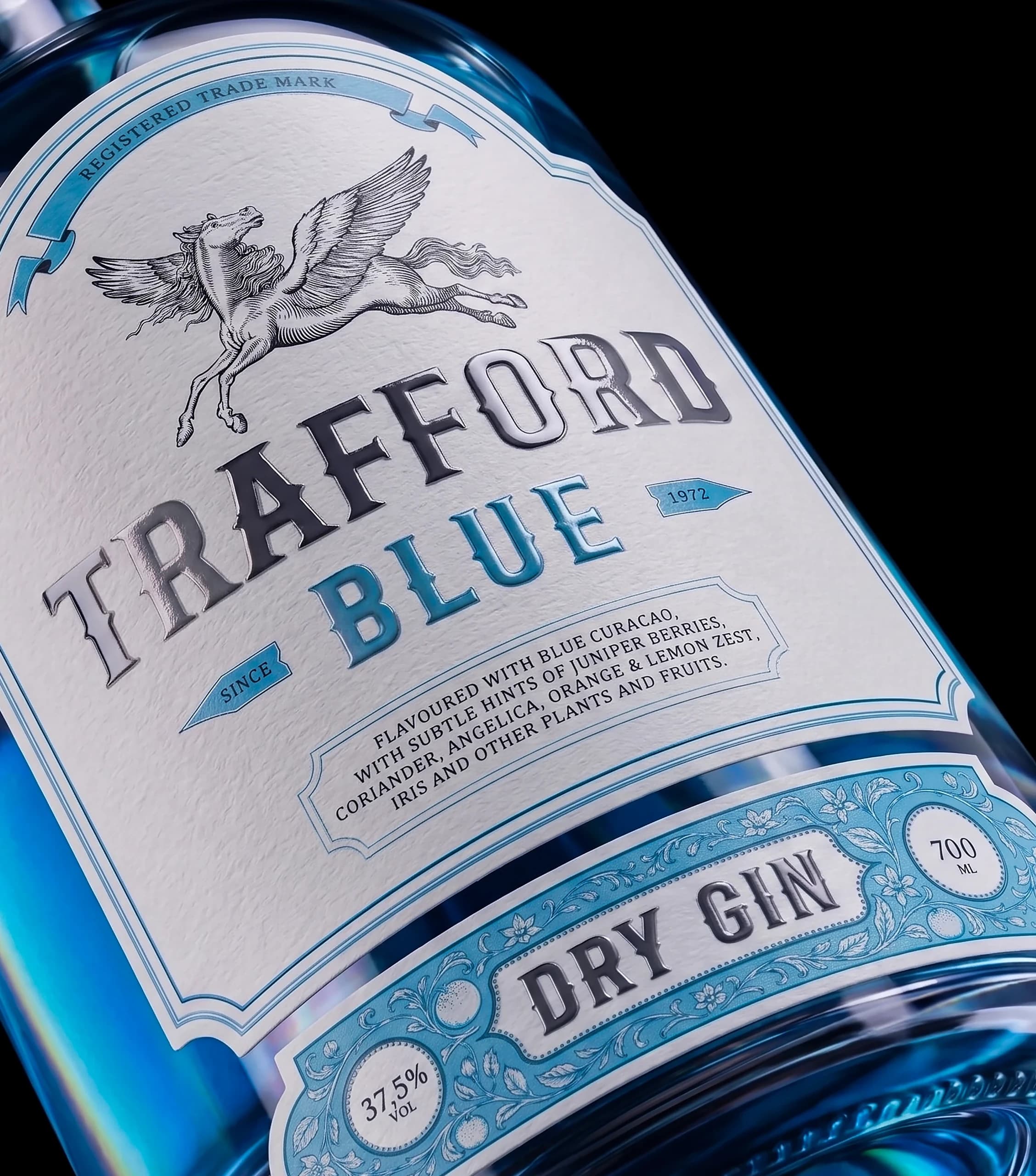 TRAFFORD BLUE — label close-up with the engraved Pegasus emblem